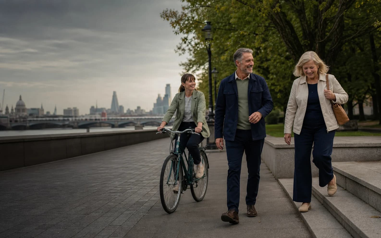 Adults of different ages walking and cycling beside the River Thames