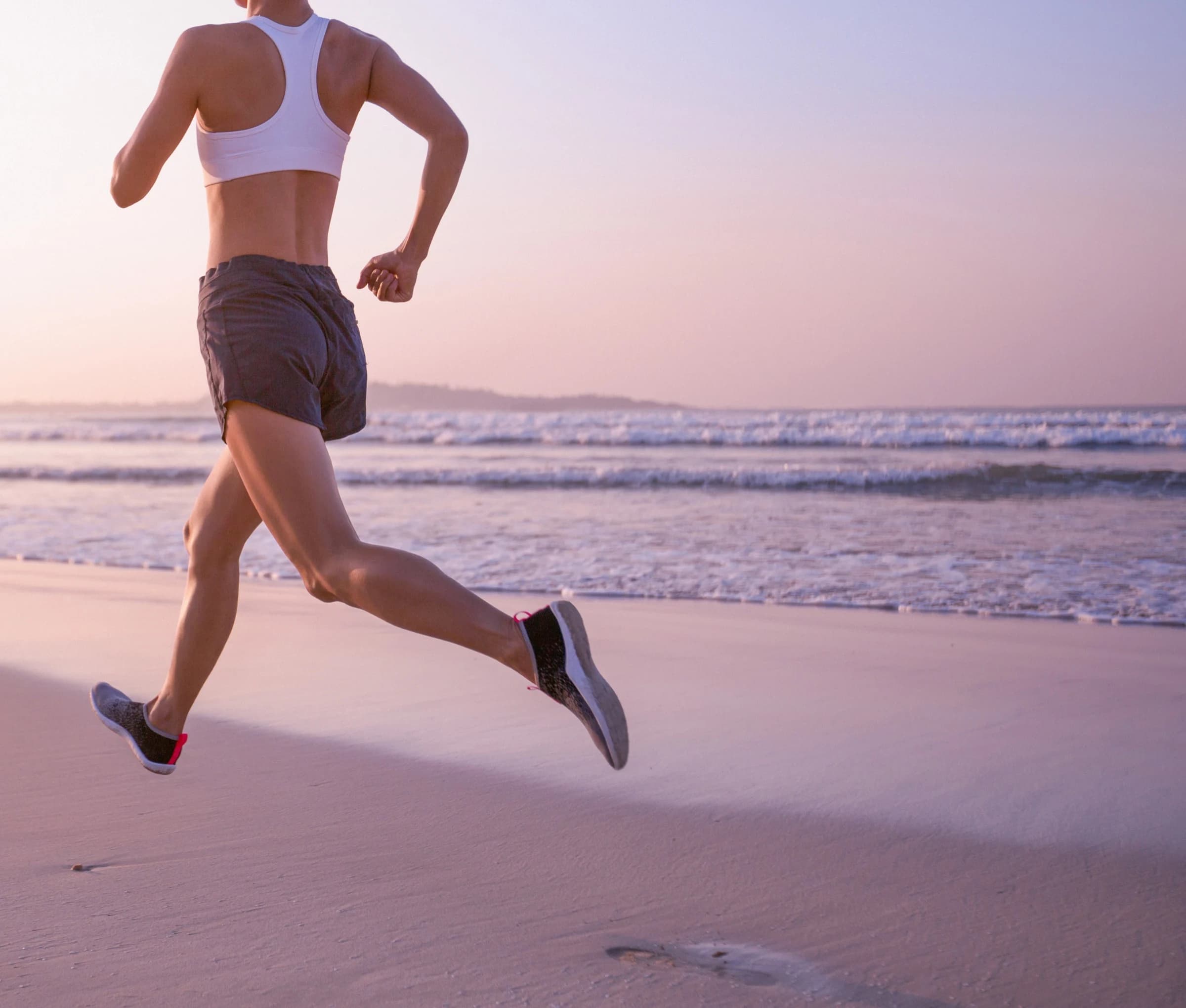 Runner moving confidently on a beach